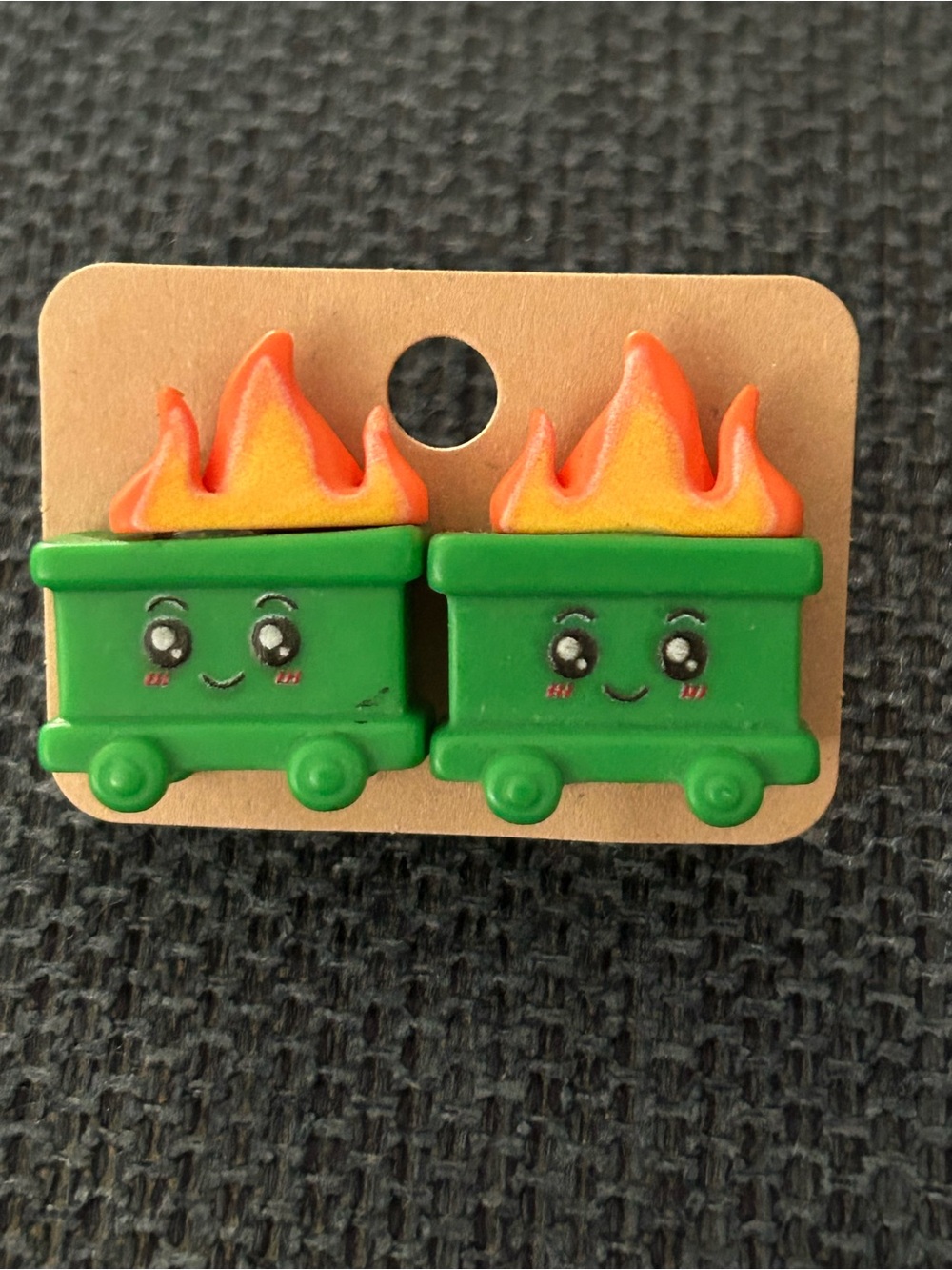 A pair of green dumpster fire Stud earrings NEW